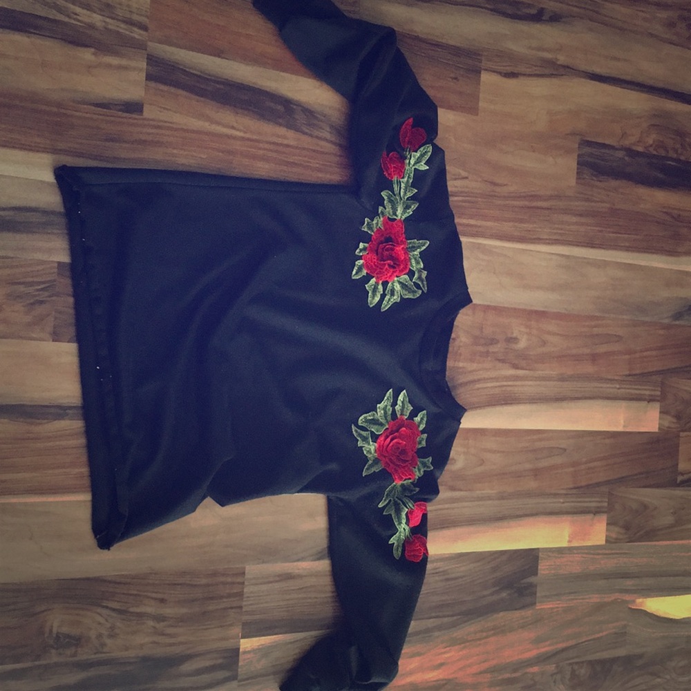 sweater with roses sowed on it.